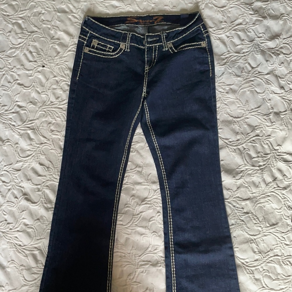 Women’s Seven7 boot cut jeans.